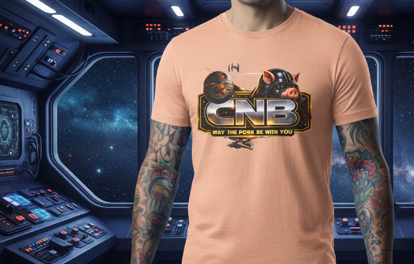 The May the Pork Be With You™ T-Shirt is built for cooks who don’t pretend to be disciplined—especially when bacon’s on the line.